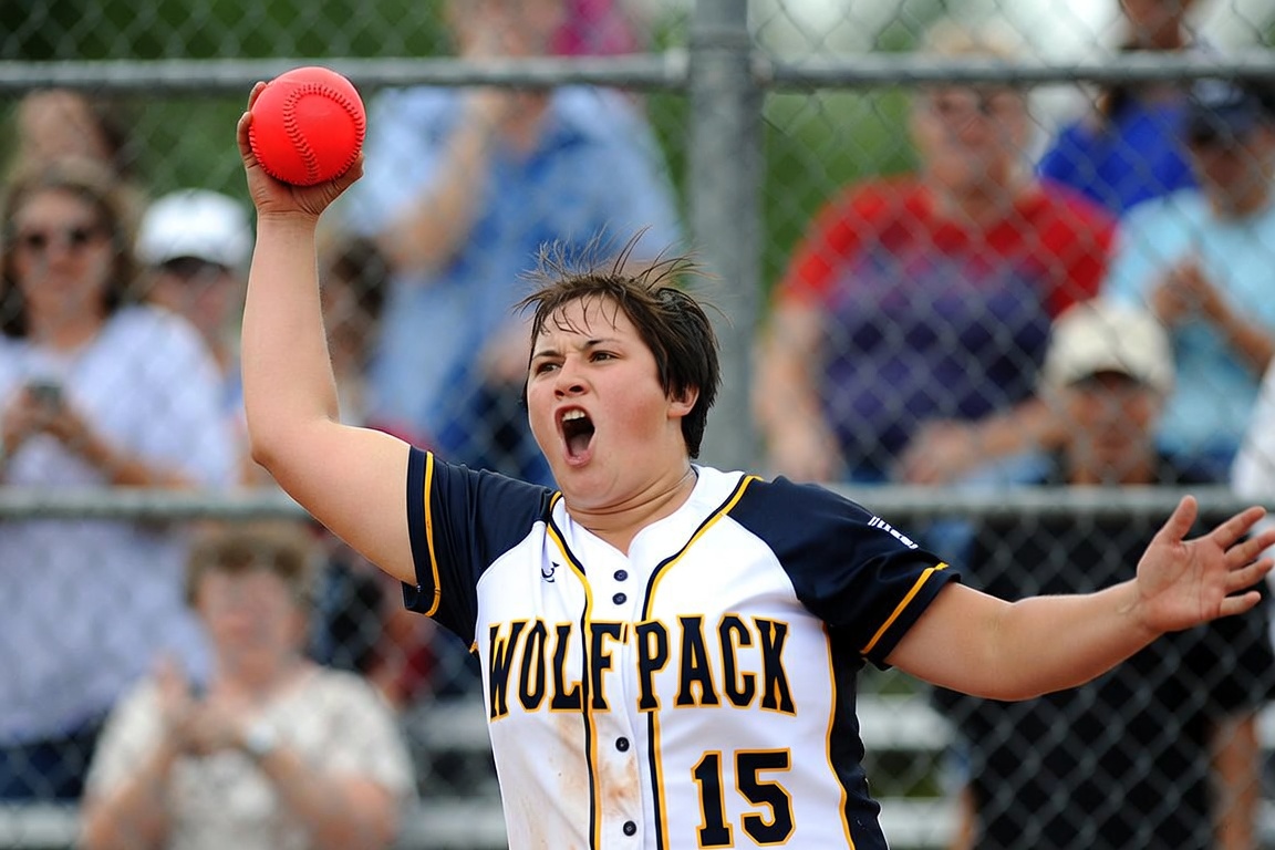 Woman frames Urbana rec softball plaque like it's a Super Bowl ring